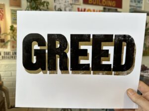 A sign that says, "GREED"